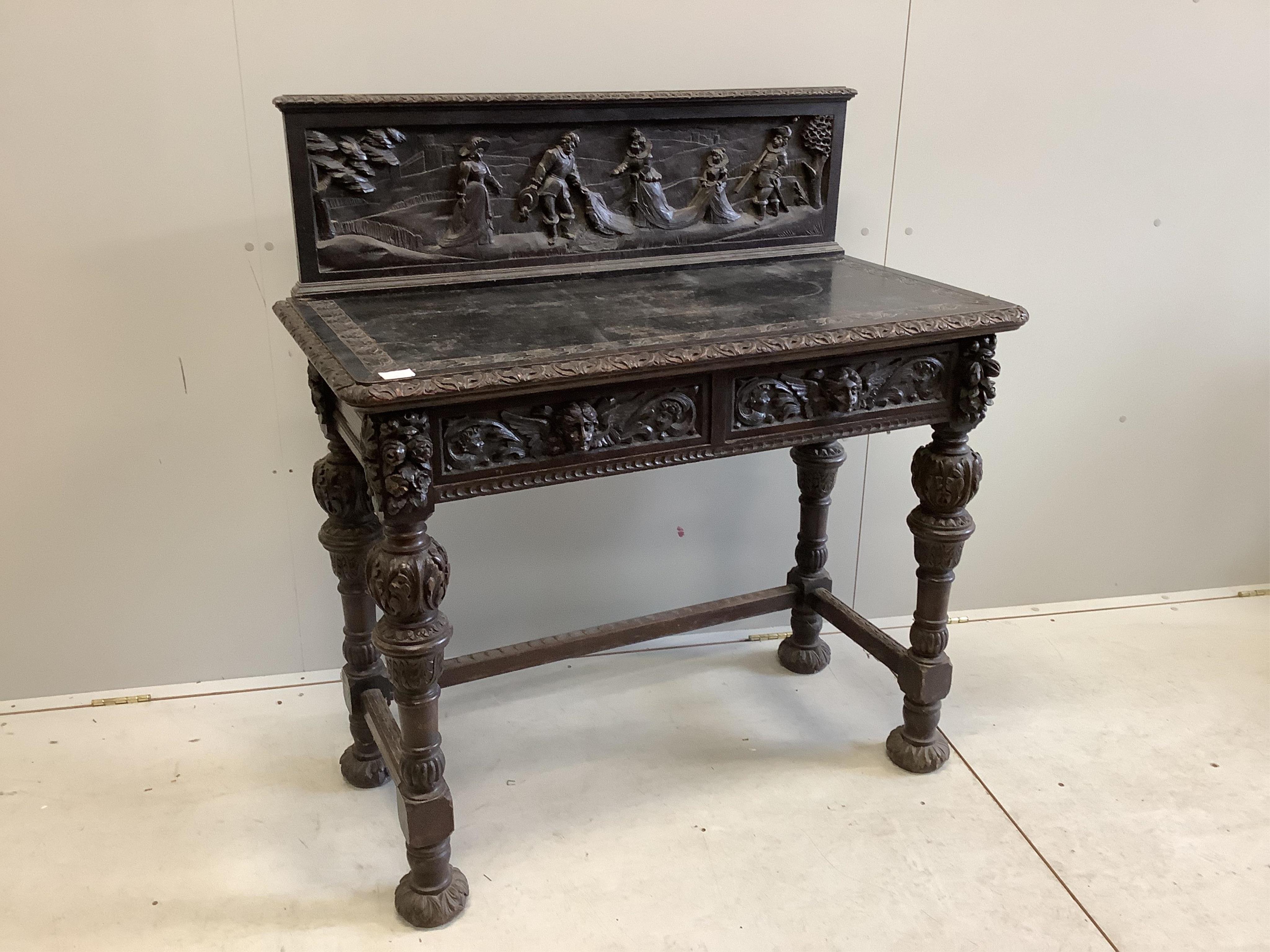 A late 19th century Flemish style carved oak side table, width 109cm, depth 53cm, height 116cm. Condition - poor to fair